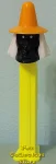Misfit Witch Pez Black Face Orange Hat on a Neon Yellow Stem (image for) Misfit Witch Pez Black Face Orange Hat on a Neon Yellow Stem